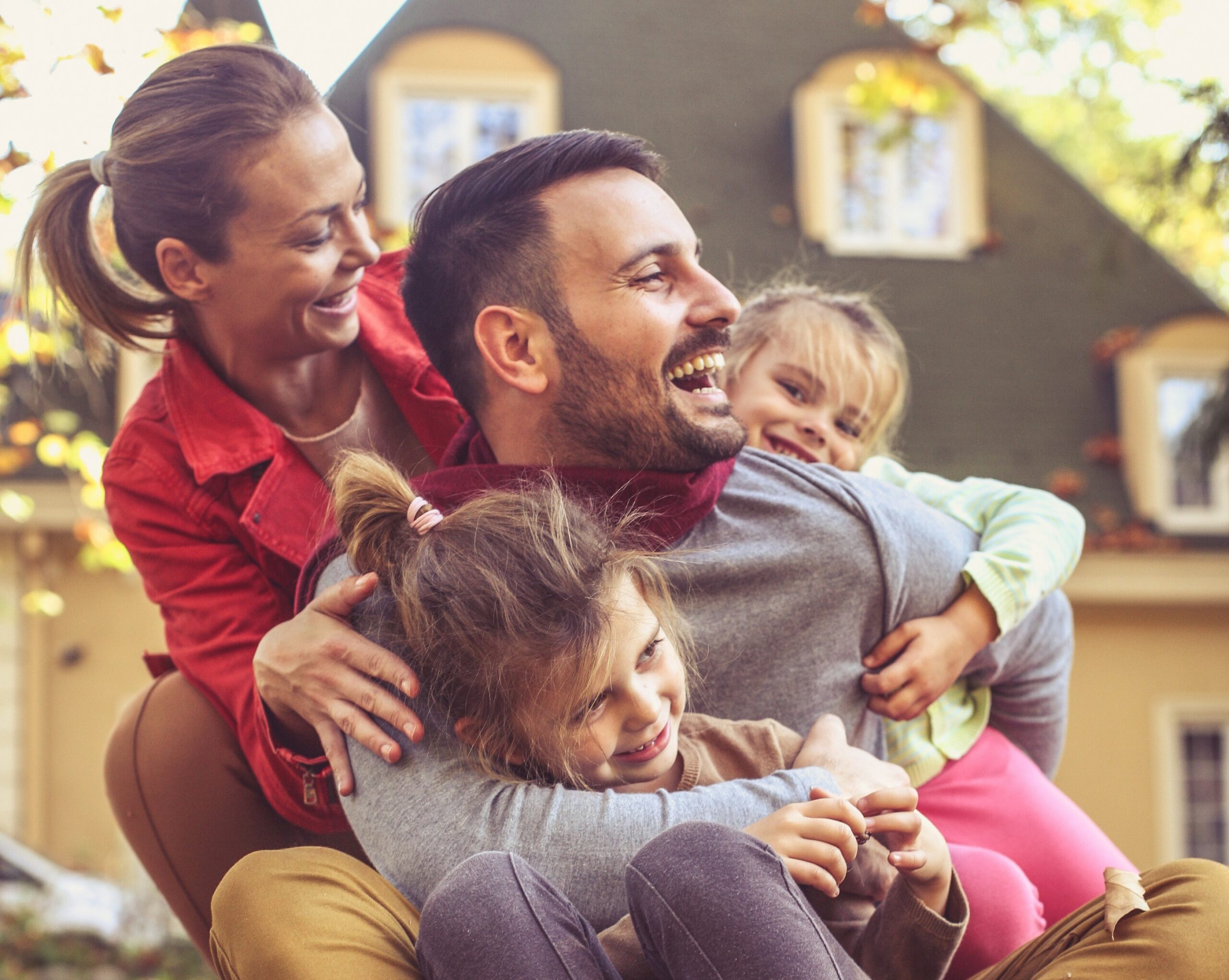 Family time, parents spending time with children outside.